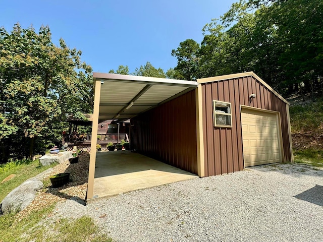 exterior space with a garage and a carport