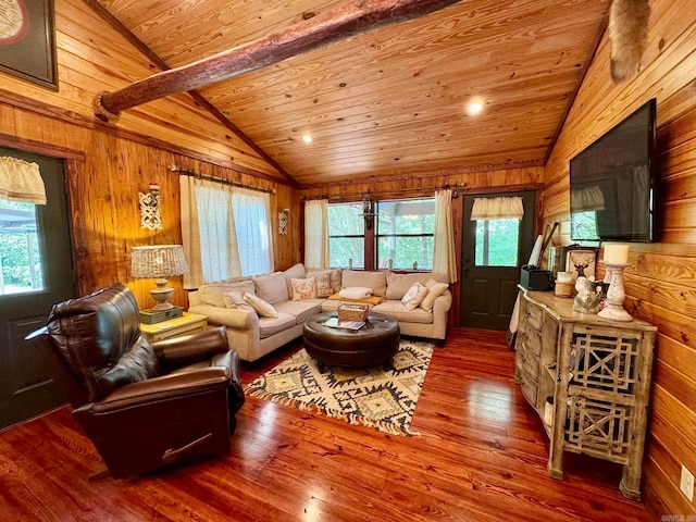 living room with wood-type flooring, vaulted ceiling with beams, wood walls, and wooden ceiling