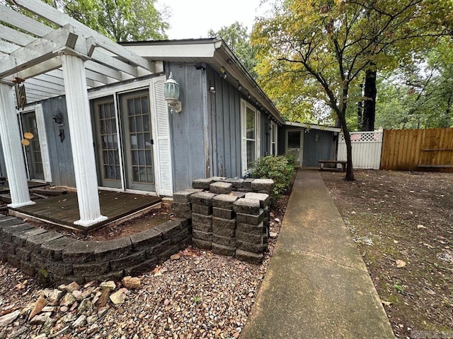 view of side of home featuring a pergola