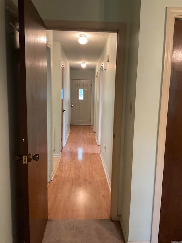 corridor featuring light hardwood / wood-style floors