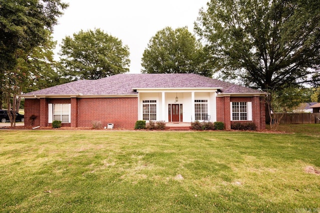 single story home featuring a front yard