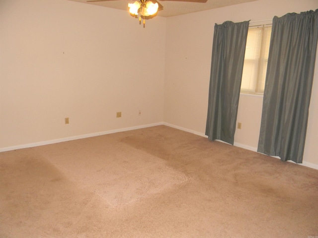 unfurnished room with ceiling fan and carpet floors