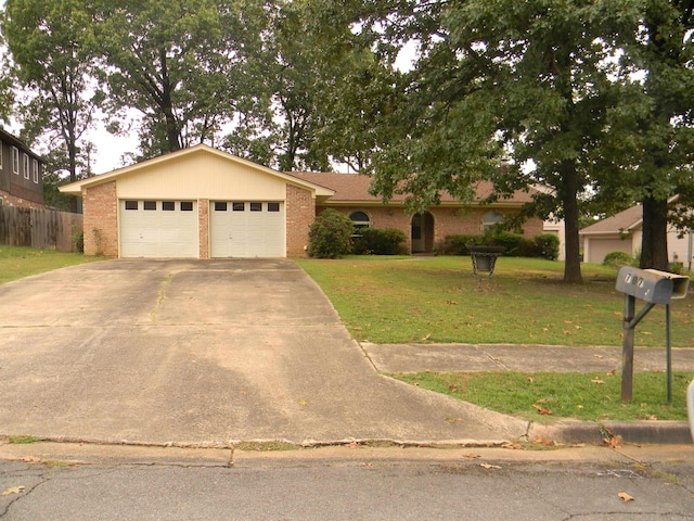 ranch-style home with a front lawn and a garage