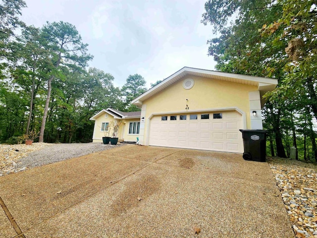 view of side of home with a garage