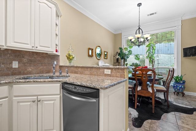 kitchen with white cabinetry, a chandelier, light stone counters, and sink