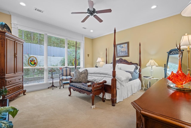 bedroom with light colored carpet, ceiling fan, and ornamental molding