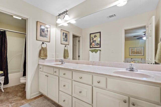 full bathroom featuring vanity, shower / tub combo, tile patterned flooring, toilet, and ceiling fan