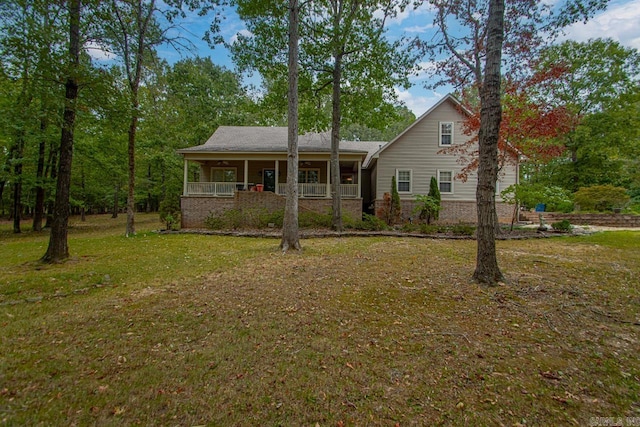 view of front facade with a porch and a front lawn