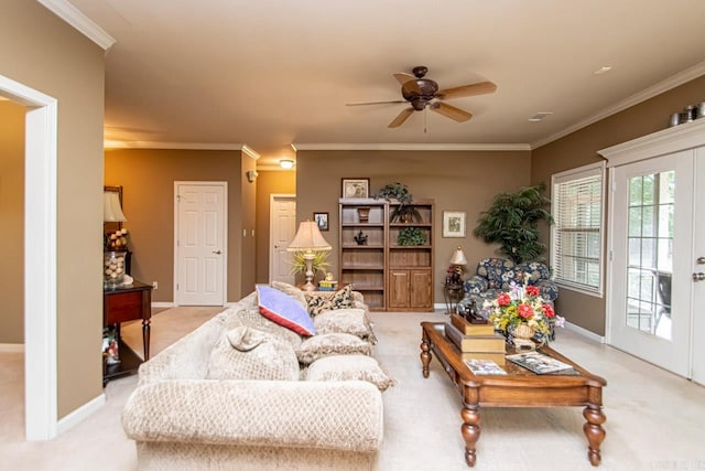 carpeted living room featuring ceiling fan, ornamental molding, and french doors