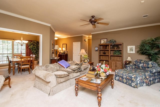 living room featuring ceiling fan with notable chandelier, carpet floors, and ornamental molding