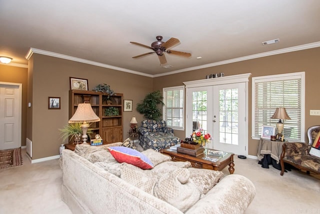 carpeted living room featuring ceiling fan, crown molding, and french doors