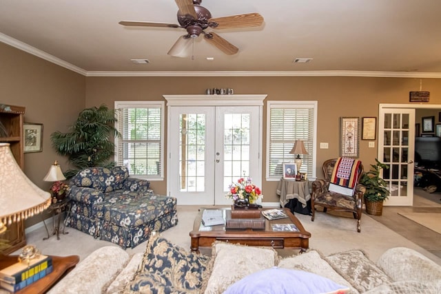 living room with french doors, crown molding, and ceiling fan