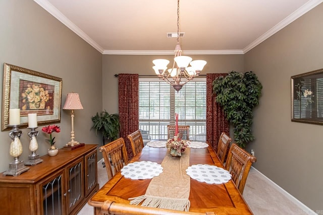 dining space with carpet floors, a chandelier, and ornamental molding