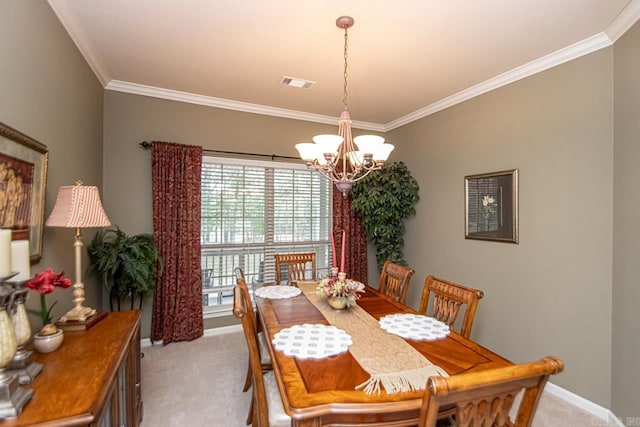 dining space with ornamental molding, light colored carpet, and an inviting chandelier