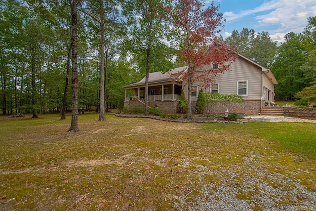 exterior space with a yard and covered porch