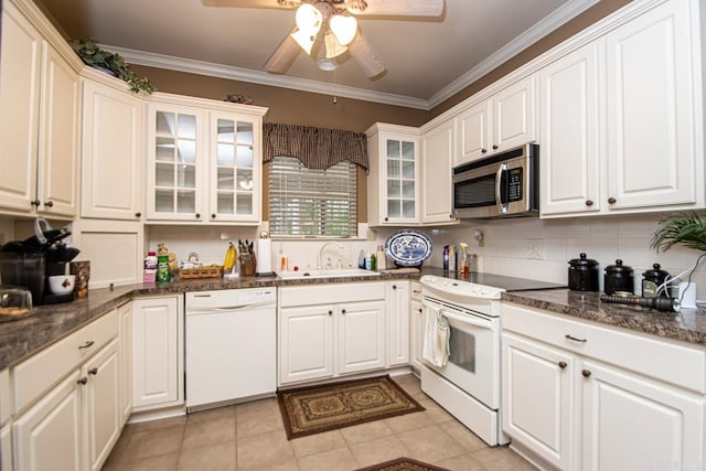 kitchen featuring ceiling fan, white cabinets, light tile patterned floors, sink, and white appliances