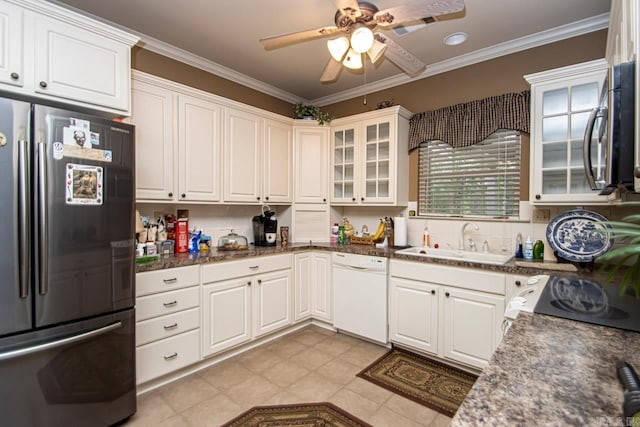 kitchen featuring sink, white cabinetry, appliances with stainless steel finishes, light tile patterned floors, and ceiling fan