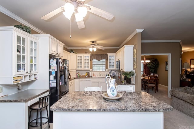 kitchen with dishwasher, ceiling fan, white cabinetry, and a breakfast bar area