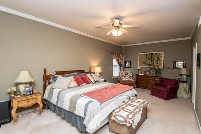 carpeted bedroom featuring ornamental molding and ceiling fan