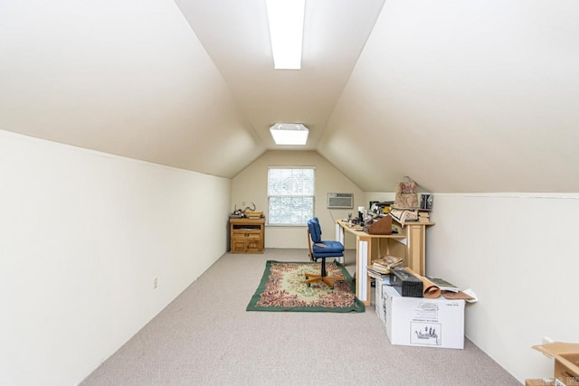 additional living space with vaulted ceiling, carpet, and a wall mounted AC