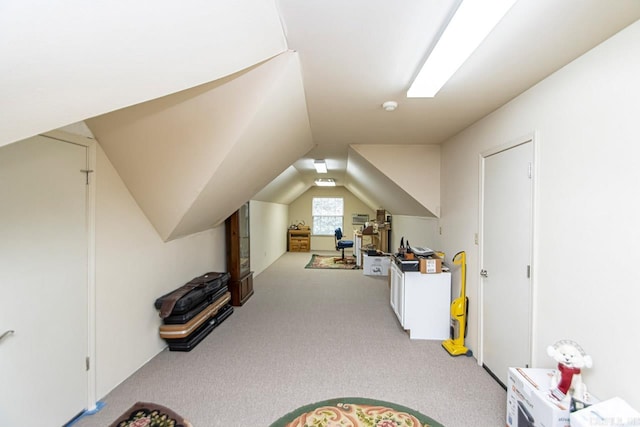 game room with lofted ceiling and light colored carpet