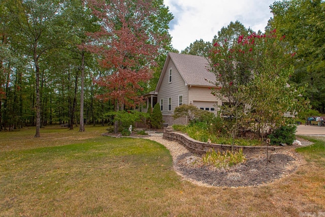 view of side of home featuring a yard