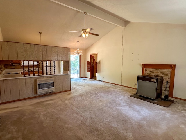 unfurnished living room featuring ceiling fan with notable chandelier, heating unit, beamed ceiling, and light carpet