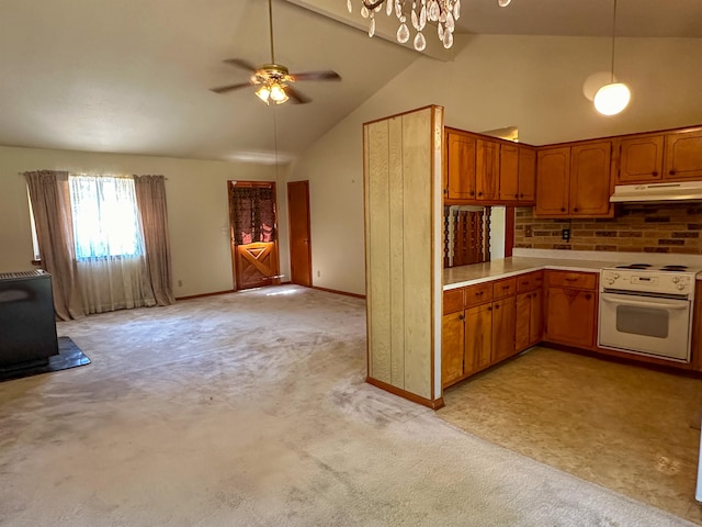 kitchen featuring ceiling fan with notable chandelier, white range oven, light colored carpet, and high vaulted ceiling