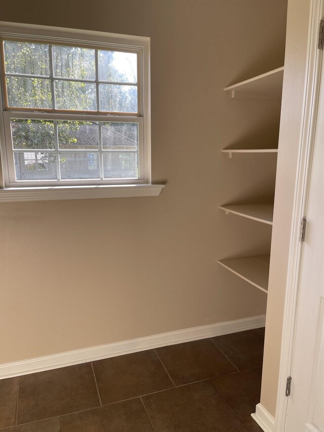 interior space with dark tile patterned floors