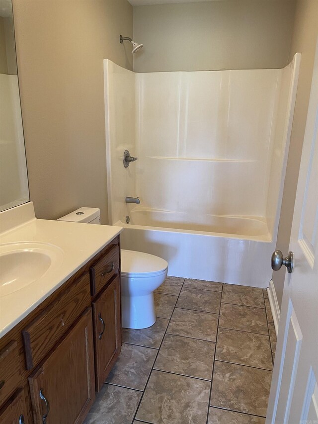 full bathroom featuring shower / tub combination, vanity, tile patterned flooring, and toilet