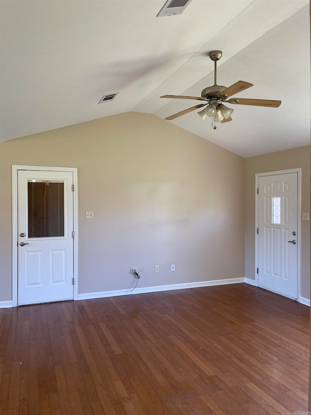 foyer entrance featuring ceiling fan, a textured ceiling, lofted ceiling, and dark hardwood / wood-style flooring