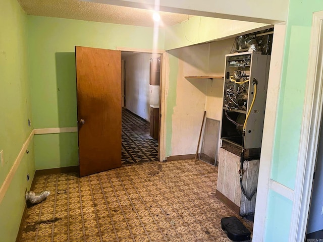 empty room with a textured ceiling