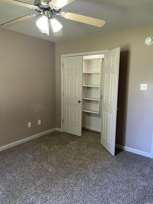 unfurnished bedroom with a closet, ceiling fan, and carpet flooring