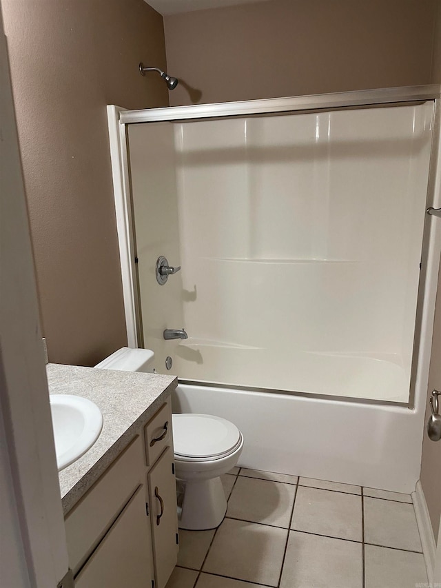 full bathroom with enclosed tub / shower combo, vanity, tile patterned flooring, and toilet