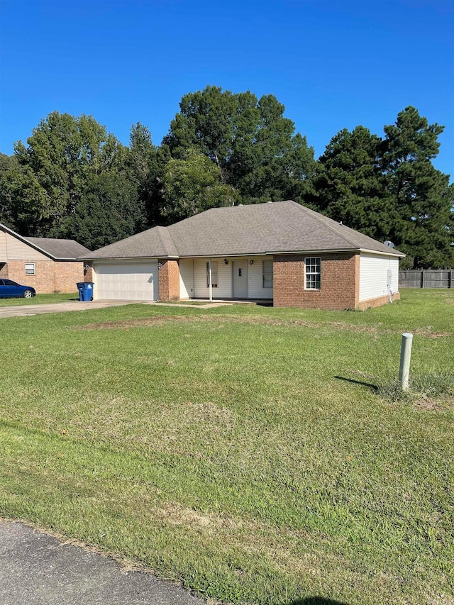 single story home with a garage and a front yard