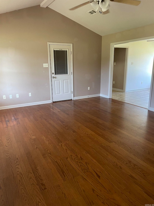 unfurnished room featuring ceiling fan, hardwood / wood-style flooring, and lofted ceiling with beams