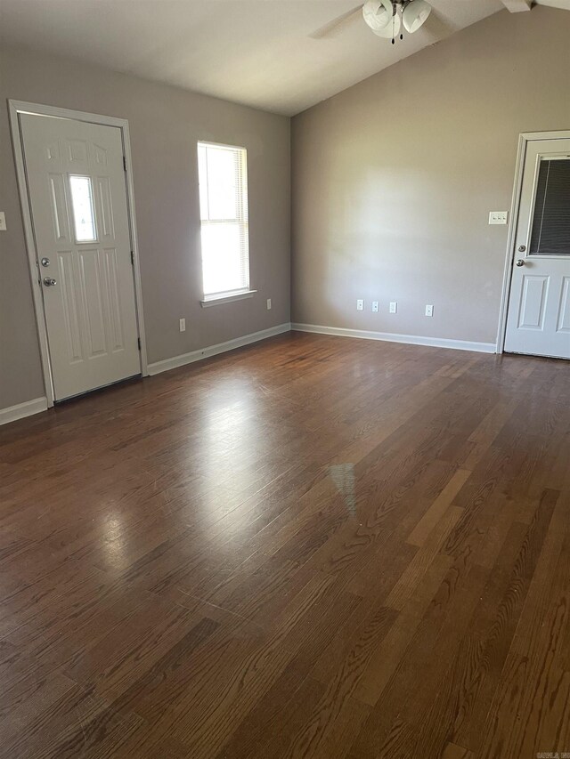 entryway featuring vaulted ceiling, ceiling fan, and dark wood-type flooring