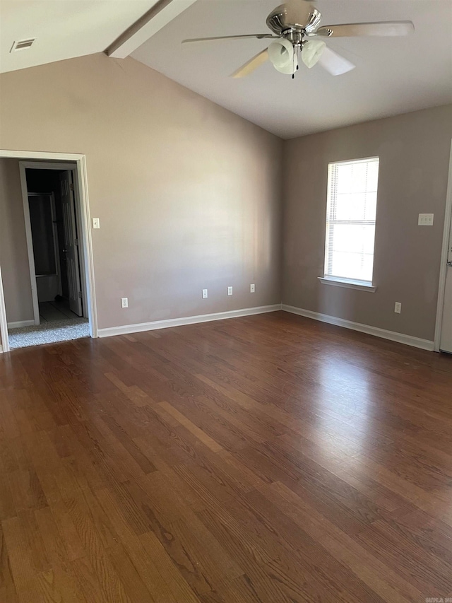 empty room with ceiling fan, dark hardwood / wood-style floors, and lofted ceiling with beams