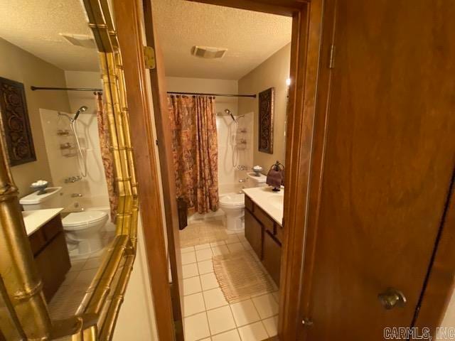 full bathroom featuring vanity, shower / bath combination with curtain, and toilet