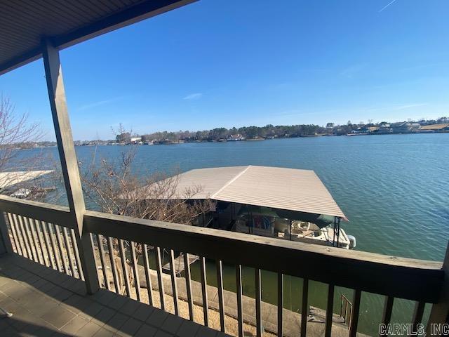 wooden deck featuring a water view