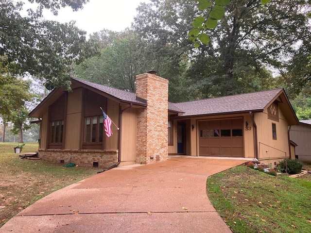 view of front of house with a garage and a front yard