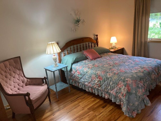 bedroom with wood-type flooring