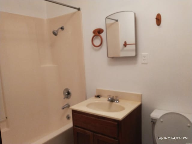 full bathroom with vanity, toilet, and shower / washtub combination