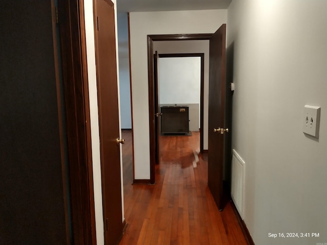 hallway featuring dark wood-type flooring