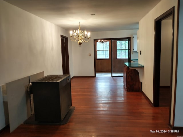 interior space with an inviting chandelier and dark wood-type flooring