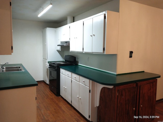 kitchen featuring black range oven, sink, dark wood-type flooring, and white cabinets