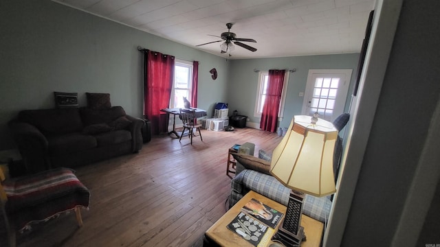 living room featuring hardwood / wood-style flooring, ceiling fan, and a wealth of natural light