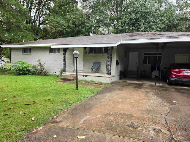 ranch-style home with a front lawn and a carport