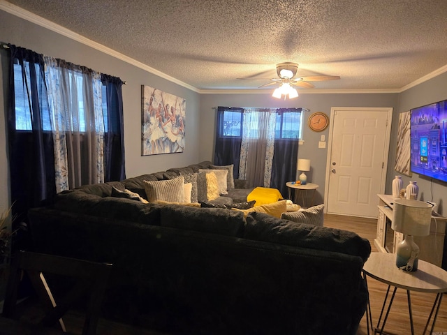 living room featuring crown molding, ceiling fan, and hardwood / wood-style flooring