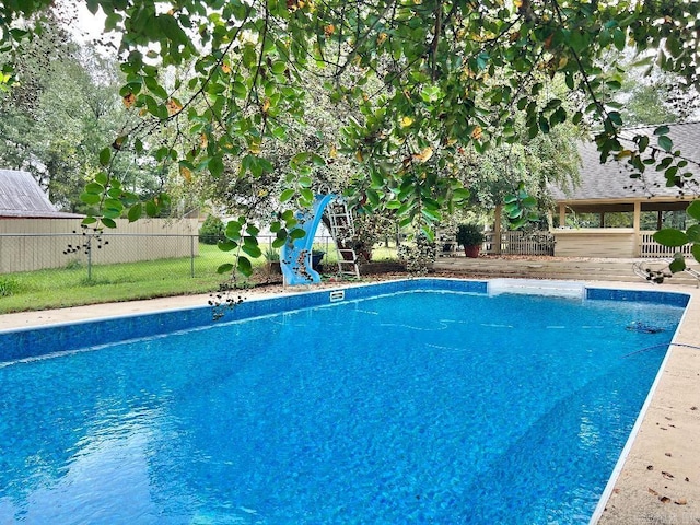 view of pool with a water slide